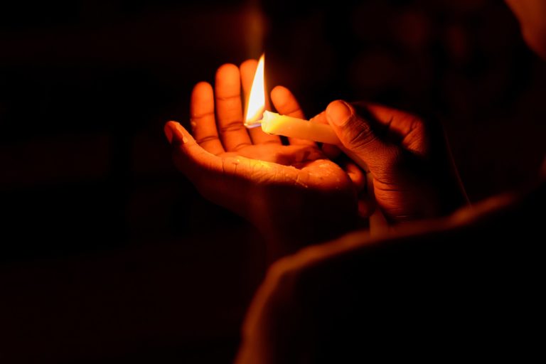 A Hand with a candle